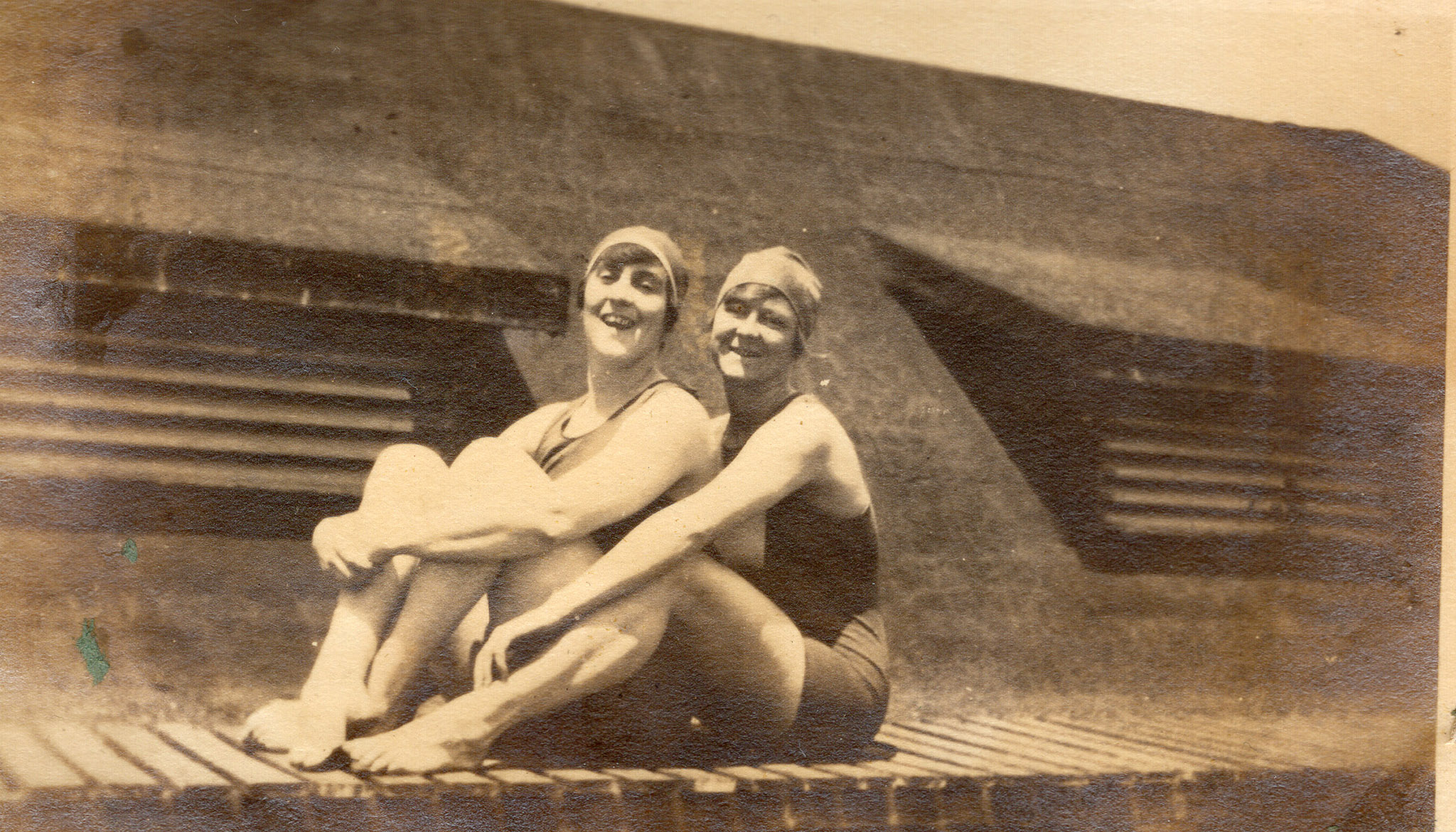 Sepia photograph with two famous Sydney swimmers Fanny Durack and Mina Wylie sitting next to each other